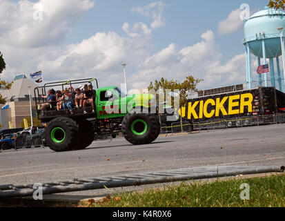 OCEAN CITY, MD - AUGUST 26, 2017: Jeep fans and thrill seekers enjoy a wild ride on a monster truck with gigantic tires in the parking lot of the Rola Stock Photo