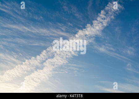 Abstract and unusual cloud formations against a blue sky, suitable for heavenly backgrounds and the clasifying of cloud and weather types. Potentially Stock Photo
