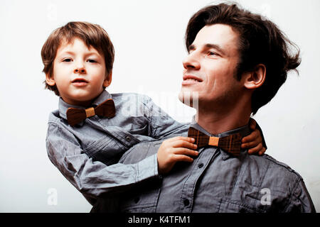 father with son in bowties on white background, casual look Stock Photo
