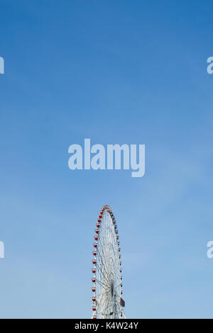 Retro colorful ferris wheel over the blue sky background. Stock Photo