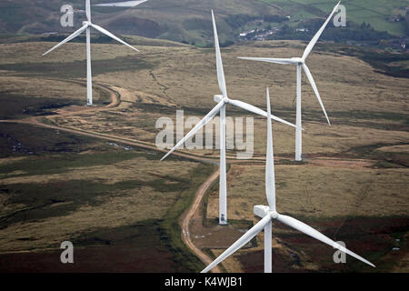 aerial view of four wind turbines on the Pennines, UK Stock Photo