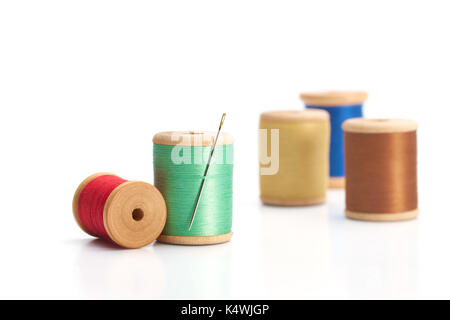 Spool of thread with needle isolated on white background Stock Photo