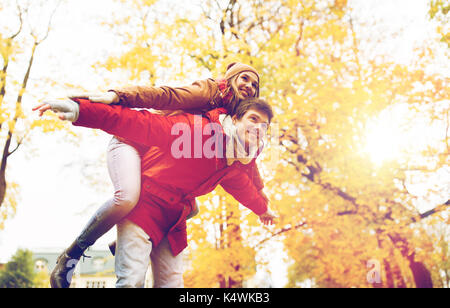 happy young couple having fun in autumn park Stock Photo