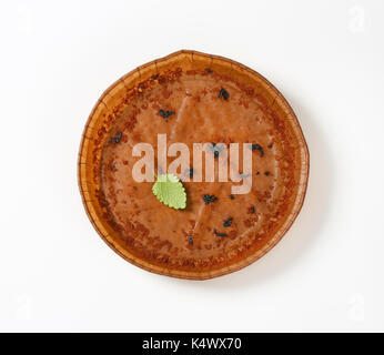 empty round paper baking pan on white background Stock Photo