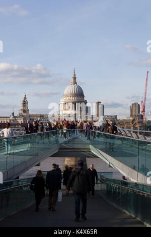 View across the Millennium Bridge, busy crowd, St Pauls Cathedral, London, UK Stock Photo