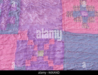 textile background - stitched pieces of silk fabric in patchwork scarf Stock Photo
