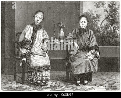 Two ancient elegant chinese women in their traditional clothes sitting at a little table. . Created by Boulanger and Carbonneau after photo of unknown author published on Le Tour du Monde Paris 1862 Stock Photo