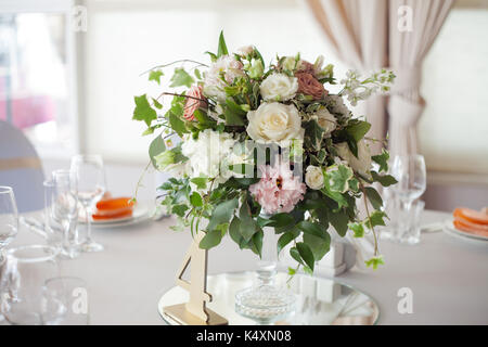 Wedding decor. Flowers in the restaurant, table setting Stock Photo