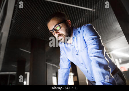 Businessman in the office working at night. Stock Photo