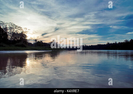 Kinabatangan, Malaysia - 09 May 2013 : Tourists on a boat cruise along the river of Kinabatangan, some of the most diverse concentration of wildlife i Stock Photo