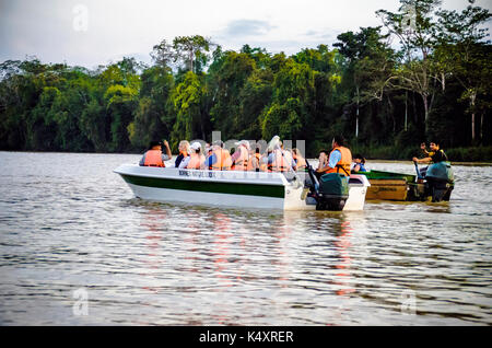 Kinabatangan, Malaysia - 09 May 2013 : Tourists on a boat cruise along the river of Kinabatangan, some of the most diverse concentration of wildlife i Stock Photo