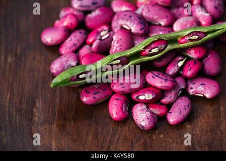 scarlet running beans - pod, flower and beans on wooden table Stock Photo