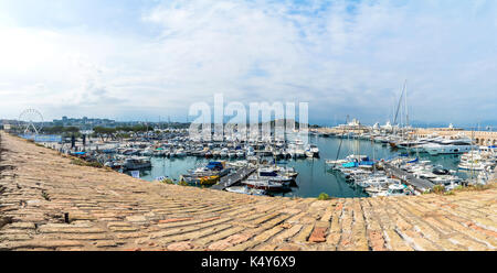 Antibes, France - July 01, 2016: wide angle view of port Vauban and skyline in Antibes, France. Port Vauban is the largest marina in the Mediterranean Stock Photo