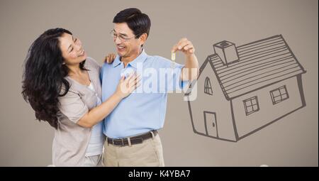 Digital composite of Couple Holding key with house drawing in front of vignette Stock Photo