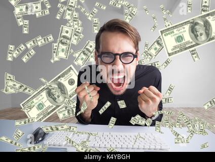 Digital composite of texting money. very happy man shouting in front of the computer,  money everywhere Stock Photo