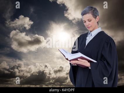 Digital composite of Female judge reading against cloudy sky Stock Photo