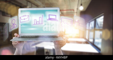 Cropped hands holding laptop against defocused image of illuminated lights Stock Photo