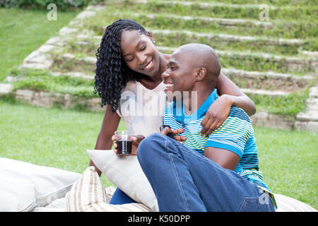 Couple relaxing in the garden Stock Photo