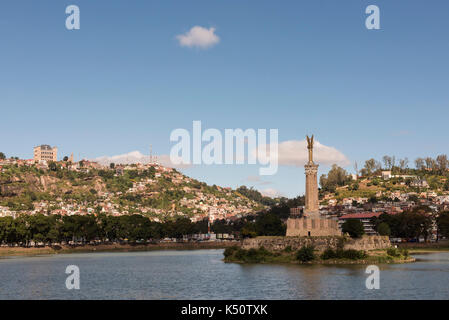 Lake Anosy with the Monument aux Morts, French monument to those fallen in first world war, and the Queen's Palace behind, Antananarivo, Madagascar Stock Photo