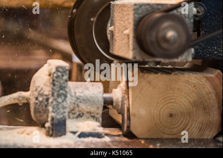 The machine for sampling the groove in a wooden beam. in progress Stock Photo