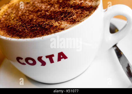 Cup of coffee (medium mocha coffee with chocolate dusting) in a uk costa coffee shop Stock Photo
