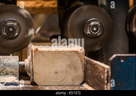 The machine for sampling the groove in a wooden beam. in progress closeup one more view Stock Photo