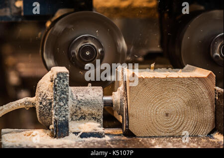 The machine for sampling the groove in a wooden beam close Stock Photo