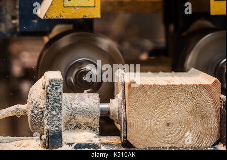 The machine for sampling the groove in a wooden beam. in progress macro Stock Photo