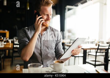 Businessman constantly working Stock Photo