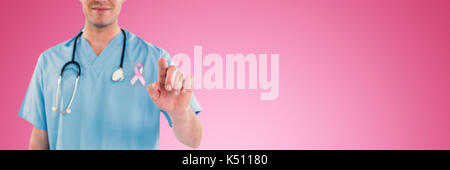 Surgeon pretending to be using futuristic digital screen against pink background Stock Photo
