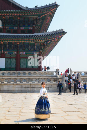 Beautiful Korean woman dressed Hanbok, Korean traditional dress, in Gyeongbokgung Palace, Seoul, South Korea Stock Photo