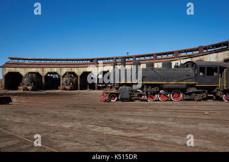 Old steam locomotives at the historic engine shed at Baquedano Railway Station in the Atacama Desert, Chile Stock Photo