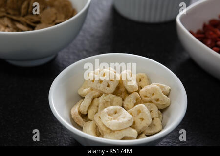 Bowl of honey combs cereals on table Stock Photo