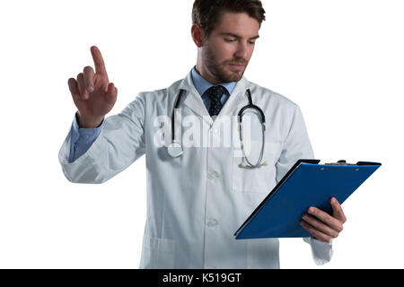 Male doctor using invisible screen against white background Stock Photo