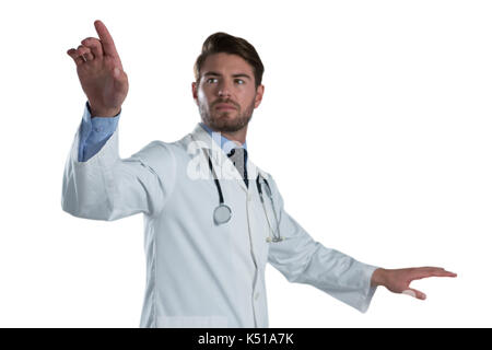 Male doctor using invisible screen against white background Stock Photo