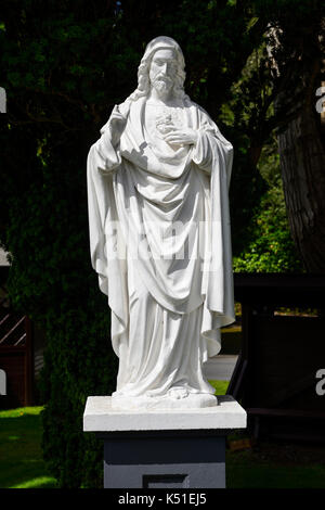 White marble statue of Jesus Christ at Kylemore Abbey in Connemara, County Galway, Republic of Ireland Stock Photo