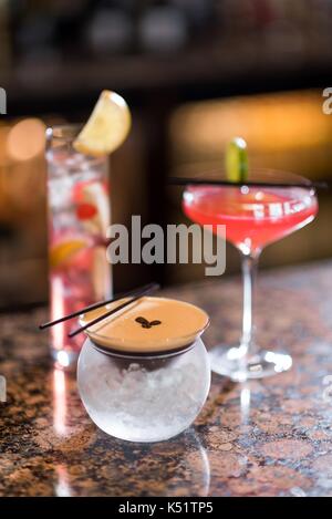 A female bartender pouring a drink Stock Photo