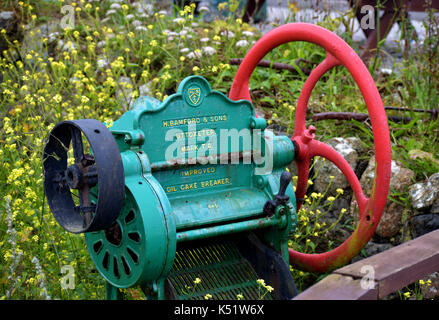 Old rusted oil cake breaker Stock Photo