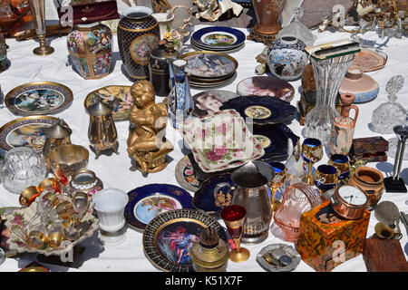 ATHENS, GREECE - MAY 31, 2015: Vintage glass decorative objects antique porcelain plates and vases for sale at flea market. Stock Photo