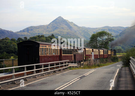 WHR '87' leaving Pont Croesor with a train for Caernarfon. Welsh Highland Railway. Stock Photo