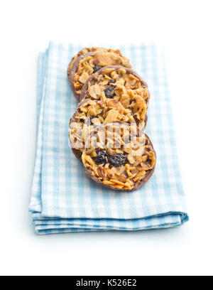 Chocolate chip cookies with nuts and raisins isolated on white background. Stock Photo