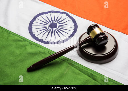 stock photo showing Indian low and jurisdiction - Indian national flag or tricolour with wooden gavel showing concept of law in India Stock Photo