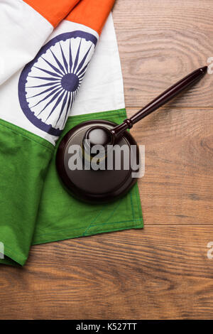 stock photo showing Indian low and jurisdiction - Indian national flag or tricolour with wooden gavel showing concept of law in India Stock Photo