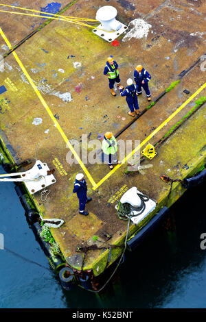 Falmouth Cornwall outer harbour dock area with ship securing up crew Stock Photo