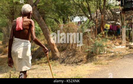 Indian man walking at the street. Stock Photo