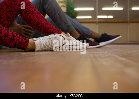 Low section of dancers on hardwood floor in studio Stock Photo