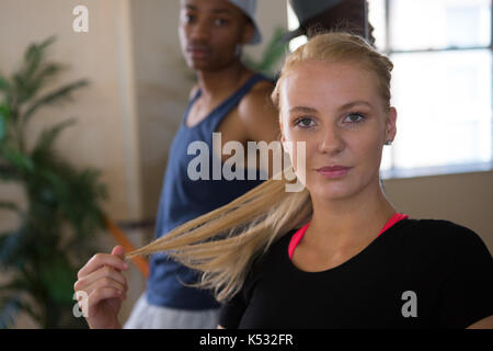 Portrait of beautiful female dancer with friend in studio Stock Photo