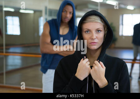 Portrait of young confident female dancer with friend in studio Stock Photo
