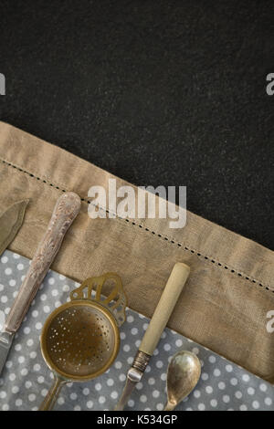 Overhead view of cutlery on napkins at table Stock Photo