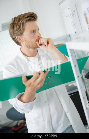 male student thinking during maths course Stock Photo